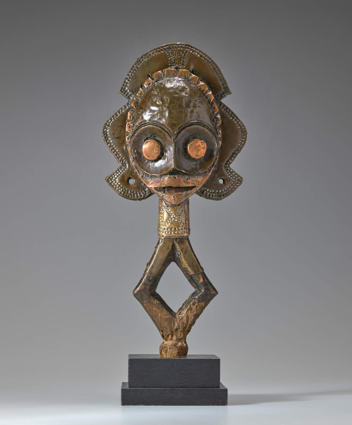 “Reliquary Guardian Figure (Mbulu Ngulu),” Kota peoples, Obamba or Mindumu group, Gabon, Africa, 19th century, wood, copper, and brass.