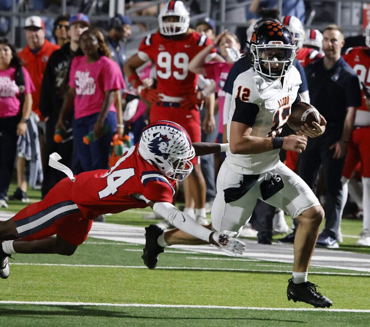 North Richland Hills Richland defensive back Marvin Hodge (34) brings down Aledo quarterback Lincoln Tubbs (12) from behind during the first half of a UIL football game on Thursday, October, 23, 2025 at Birdville FAAC Stadium in North Richland Hills, Texas.