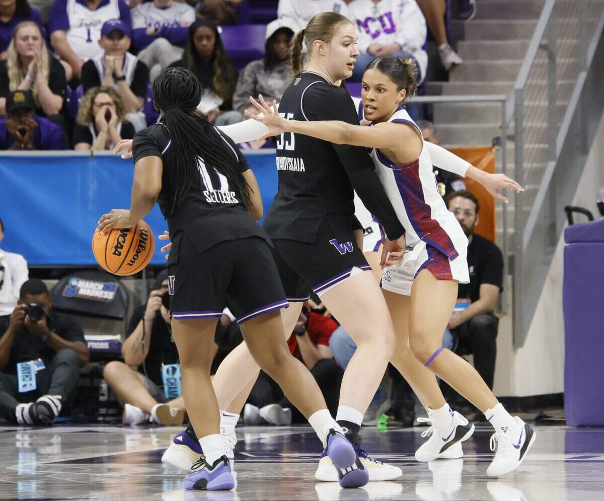 TCU guard Donovyn Hunter (4) gets boxed out by Washington center Yulia Grabovskala (55) during the first half of a second round NCAA Division I Women's Basketball Championship game at Schollmeier Arena in Fort Worth, Texas, Sunday, March, 22, 2026.