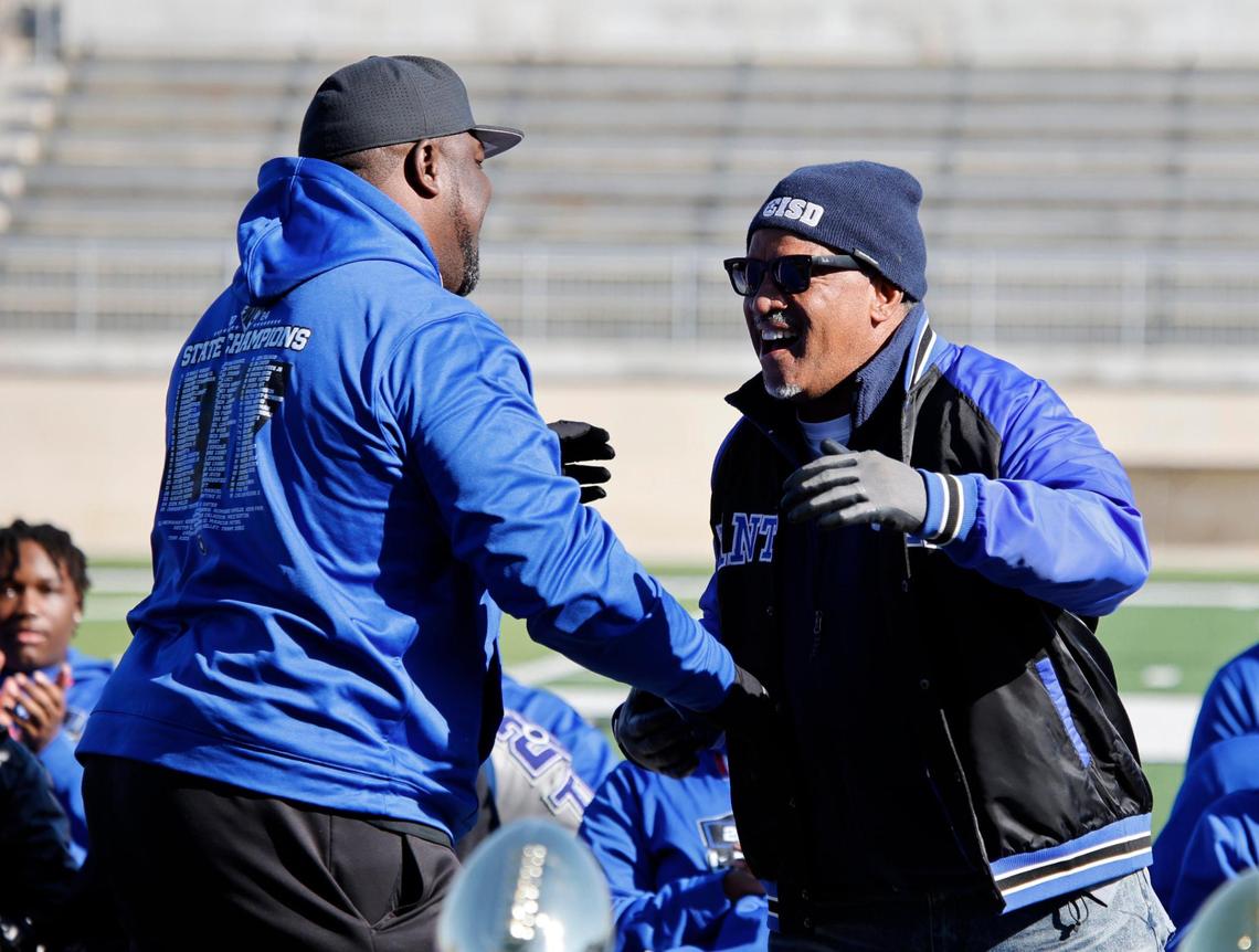 Crowley ISD Superintendent Dr. Michael McFarland, right, congratulates and announces head coach Ray Gates as the MaxPreps National coach of the year during the UIL 6A D1 Championship Parade at Crowley ISD Multi-purpose Stadium in North Crowley, Texas, Saturday, Jan. 18, 2025.