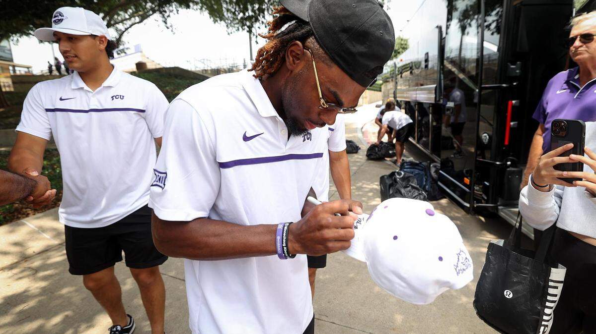 TCU infielder Tre Richardson signs autographs for fans before leaving Fort Worth for Omaha and the College World Series on Wednesday. TCU’s first opponent will be Oral Roberts University.