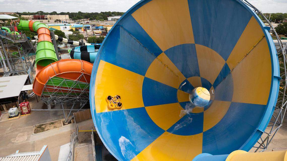 A group rides a tube on the Tornado ride Wednesday, June 1, 2022, at Hurricane Harbor in Arlington.