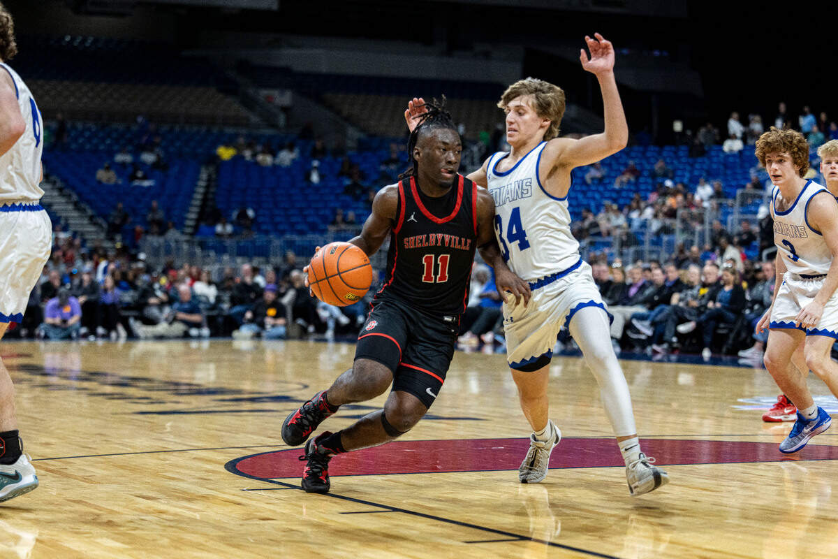 Shelbyville’s D.J. Barnes (11) tries to drive around Lipan’s Court Gaylor (34) in the Class 2A state championship game on Saturday, March 9, 2024 at the Alamodome in San Antonio, Texas. Lipan defeated Shelbyville 47-36.