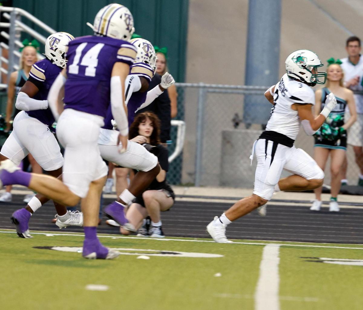 Carroll running back Davis Penn (3) races down the side lines for a Dragon touchdown in the first half of a UIL high school football game at Keller ISD Stadium in Keller, Texas, Thursday, Sept. 14, 2023.