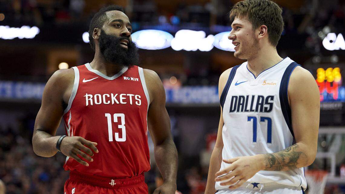 Houston Rockets guard James Harden, left, and Dallas Mavericks forward Luka Doncic exchanged friendly words during Saturday’s 107-104 Mavs win. Doncic scored 11 of his 21 points in the final 2:49 of the game to help overcome an eight-point deficit.