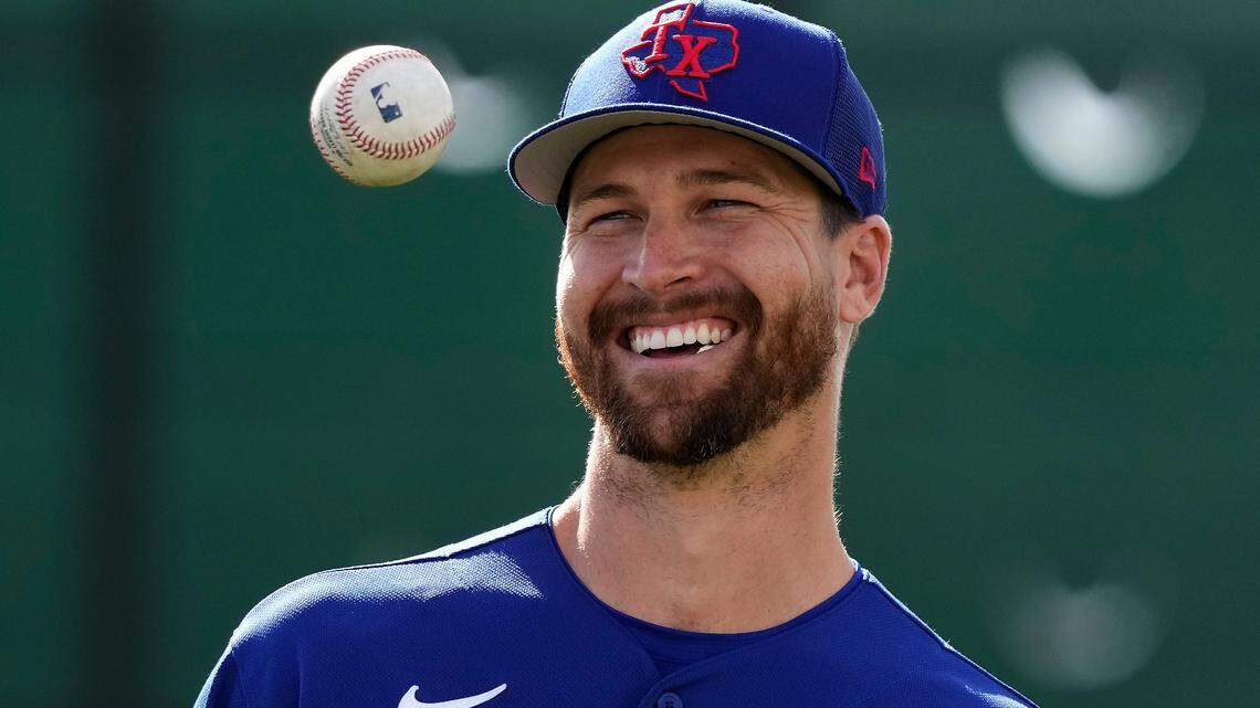 Texas Rangers pitcher Jacob deGrom waits to throw during spring training baseball practice Sunday, Feb. 19, 2023, in Surprise, Ariz. (AP Photo/Charlie Riedel)