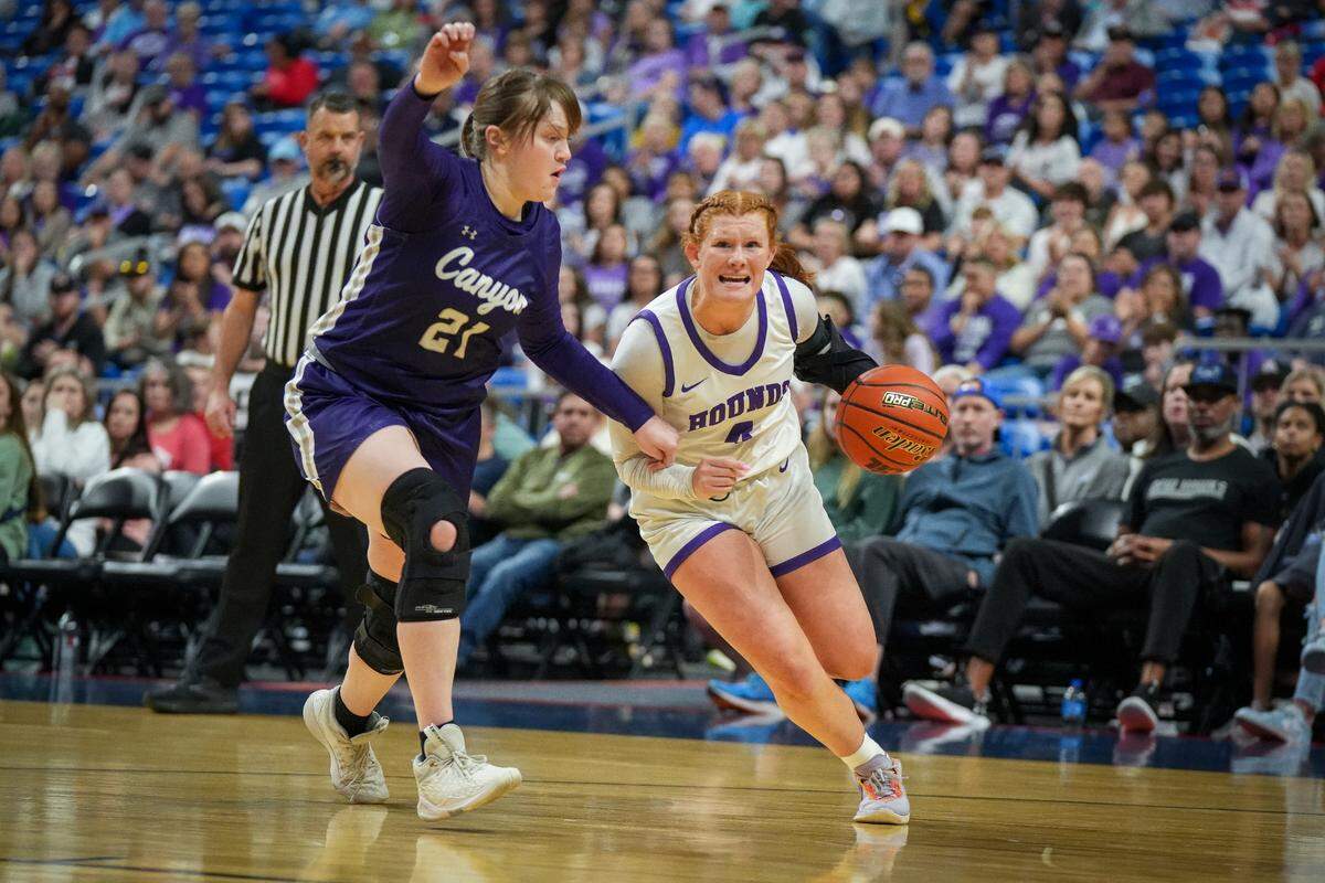 Boerne’s Chloe Donnell tries to drive around Canyon’s Jaylee Moss in a Class 4A state semifinal on Friday, March 1, 2024 at the Alamodome in San Antonio, Texas. Canyon defeated Boerne 53-39.