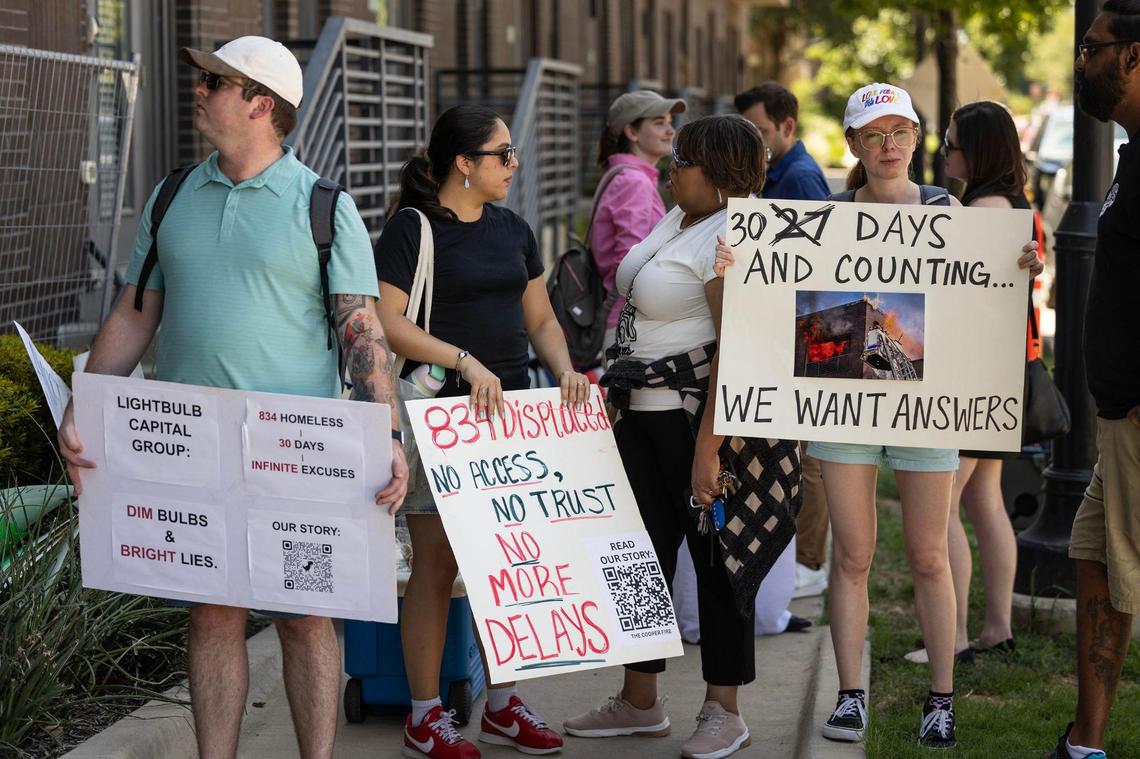 The Cooper residents protest outside the building in Fort Worth on Wednesday, July 23. Residents planned the protest to mark one month since The Cooper apartment fire displaced the tenants, leaving them without their belongings.