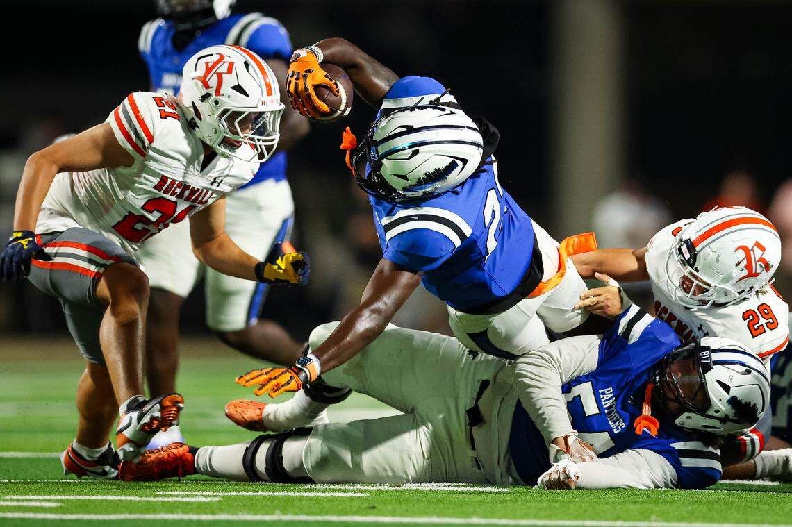 North Crowley defensive end Demerick Isaac reaches for a first down after taking a handoff for a running play in a non-district game between North Crowley and Rockwall at Crowley ISD Stadium in Crowley, Texas on Sept. 18, 2025.