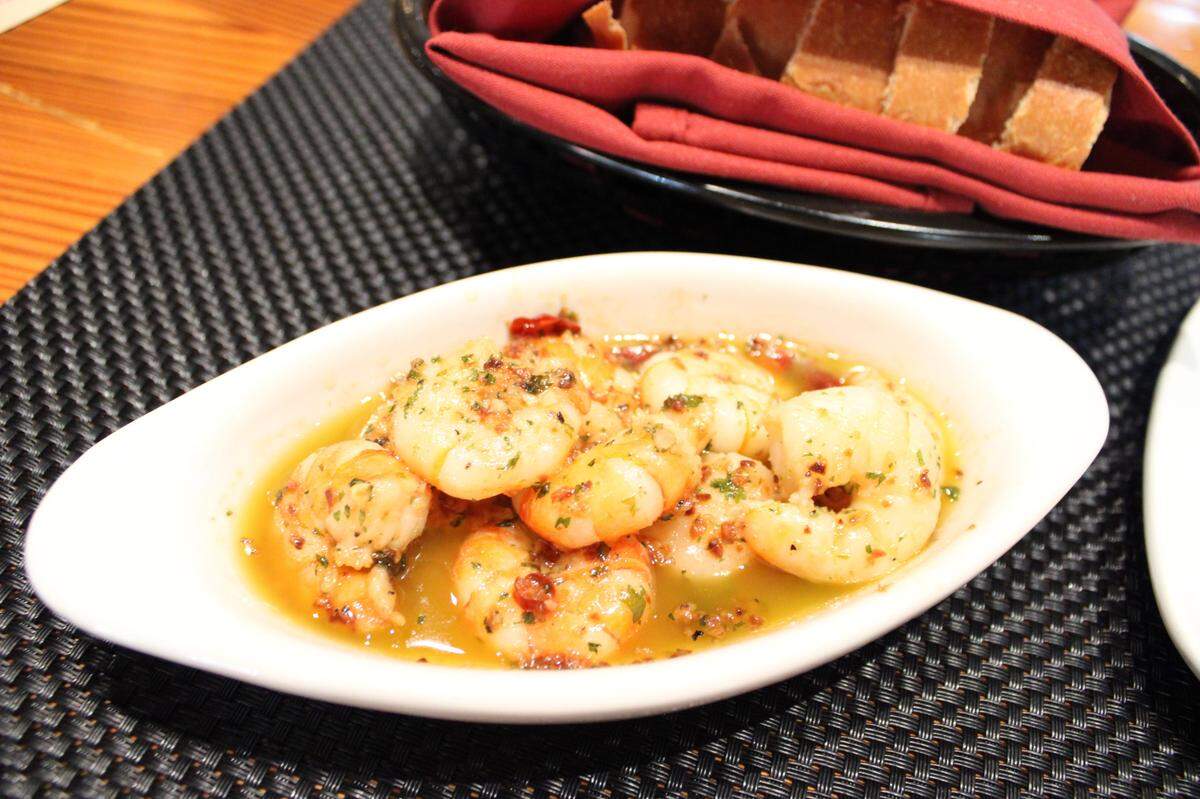 Gambas Al Ajullo is served with soft bread at Si Tapas in Fort Worth.