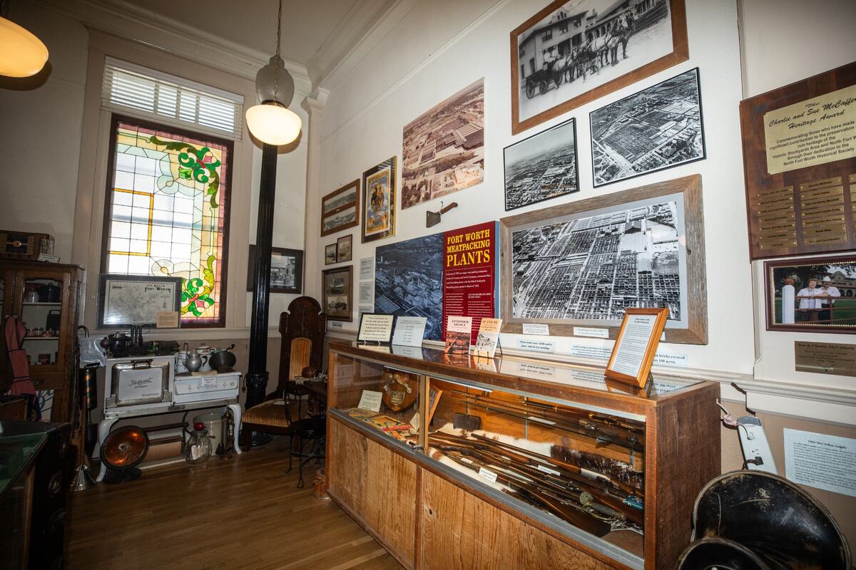 A photograph of the stockyards in the 1940s hangs on the wall along with various artifacts on Wednesday, July 10 at the Stockyard History Museum in Fort Worth. New Developments to the stockyard will consist of refurbished cattle pens.