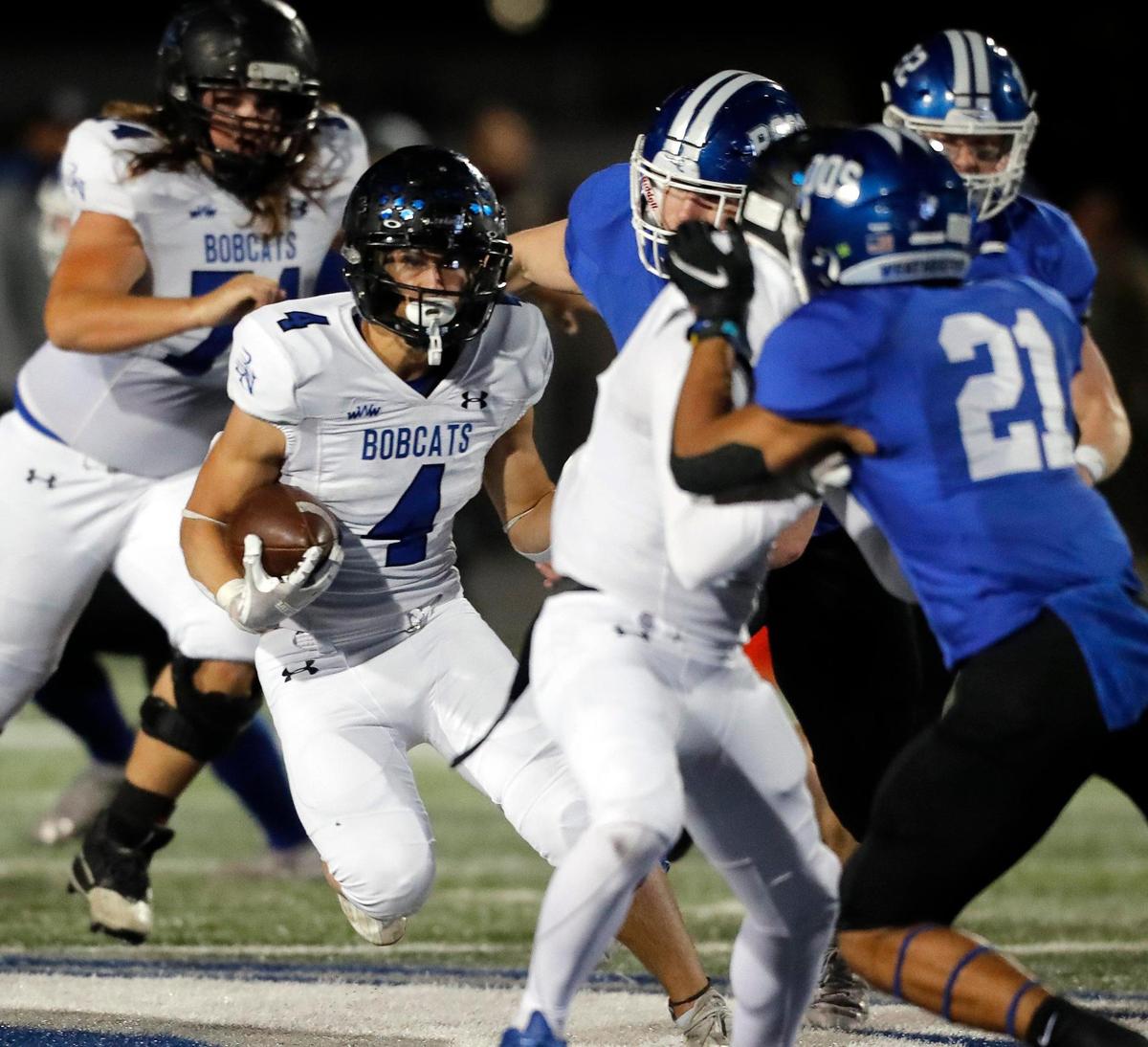 Byron Nelson’s Michael Giordano (4) follows his blocker through a gap in a 6A Division 2 bi-district football playoff game at Kangaroo Stadium in Weatherford, Texas, Friday Nov. 12, 2021. Byron Nelson led 21-7 at the half. (Special to the Star-Telegram Bob Booth)