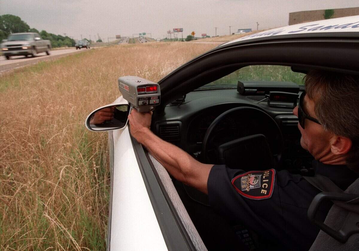 May 28, 1999: Southlake police officer Buddy Sanders runs his radar on westbound Texas 114 at Wall Street.