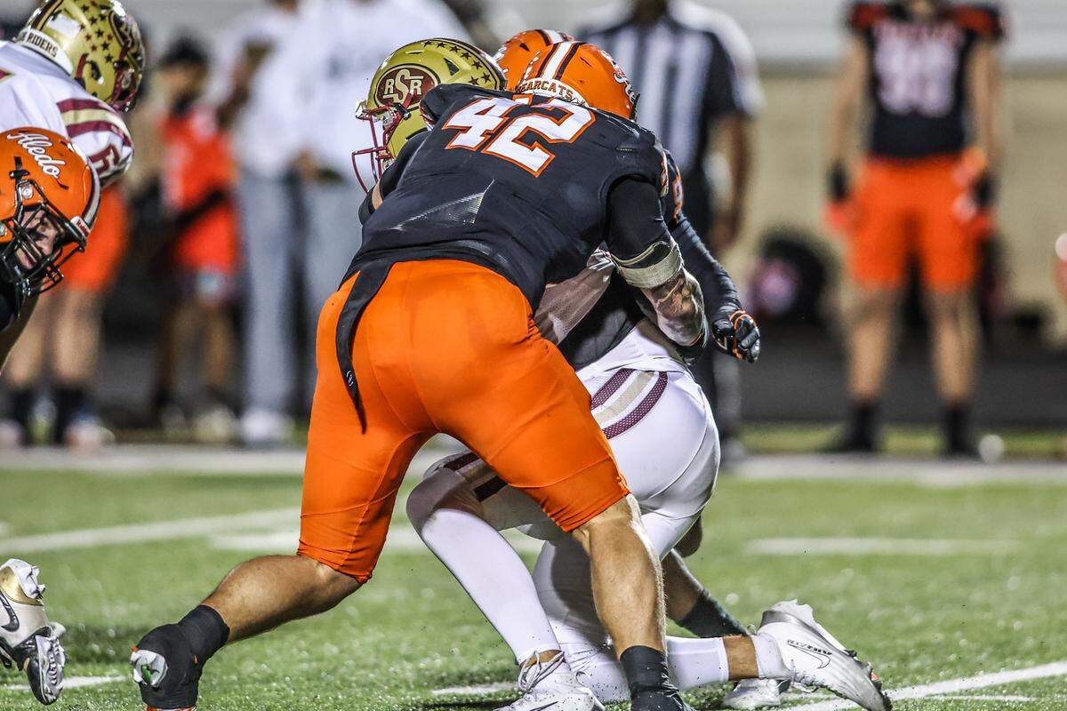 Aledo’s Cooper Cyphers (42) gets a sack against Saginaw in a Class 5A Division I bi-district playoff game on Thursday, November 13, 2025 at Tim Buchanan Stadium in Aledo, Texas.