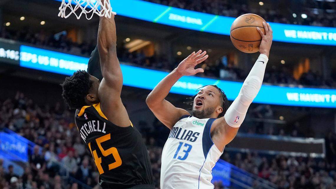 Jalen Brunson shoots as the Utah Jazz’s Donovan Mitchell defends in the first half of the Dallas Mavericks’ series-clinching win in Game 6 in Salt Lake City Thursday night. Brunson and the Mavs will open their Western Conference semifinal series against the top-seeded Phoenix Suns in Arizona Monday night.