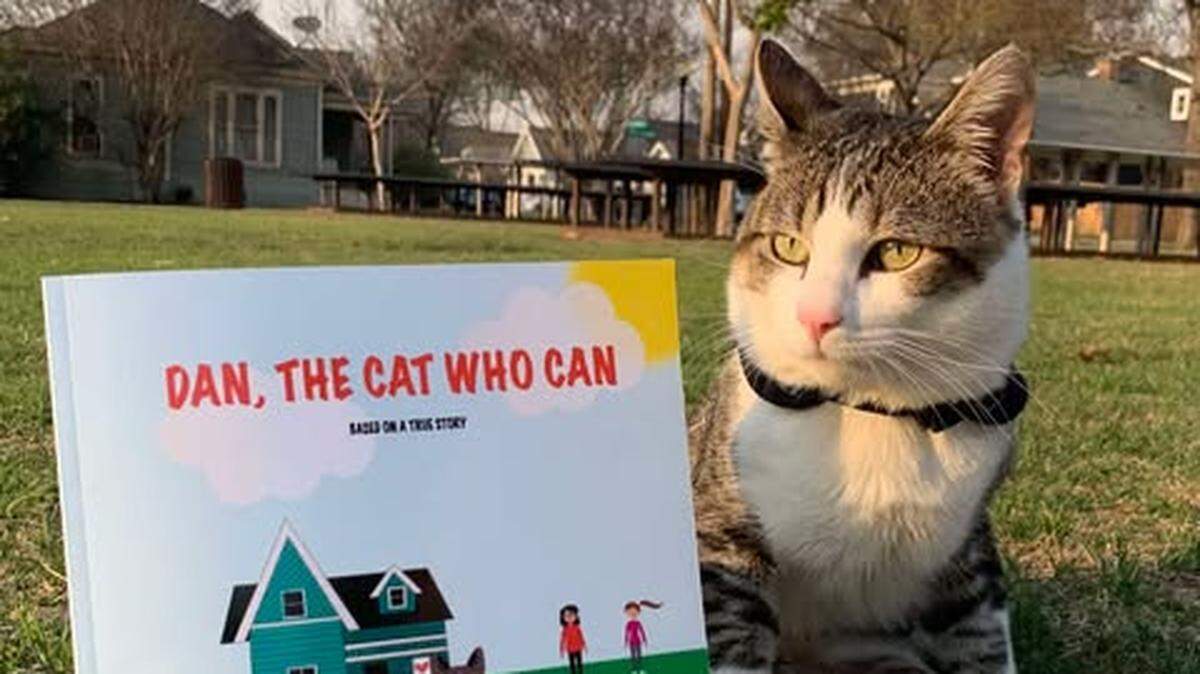Lieutenant Dan poses beside the children’s book inspired by his story, Dan, The Cat Who Can. The paraplegic cat was voted the winner of the Star-Telegram’s Cutest Cat in Fort Worth contest.