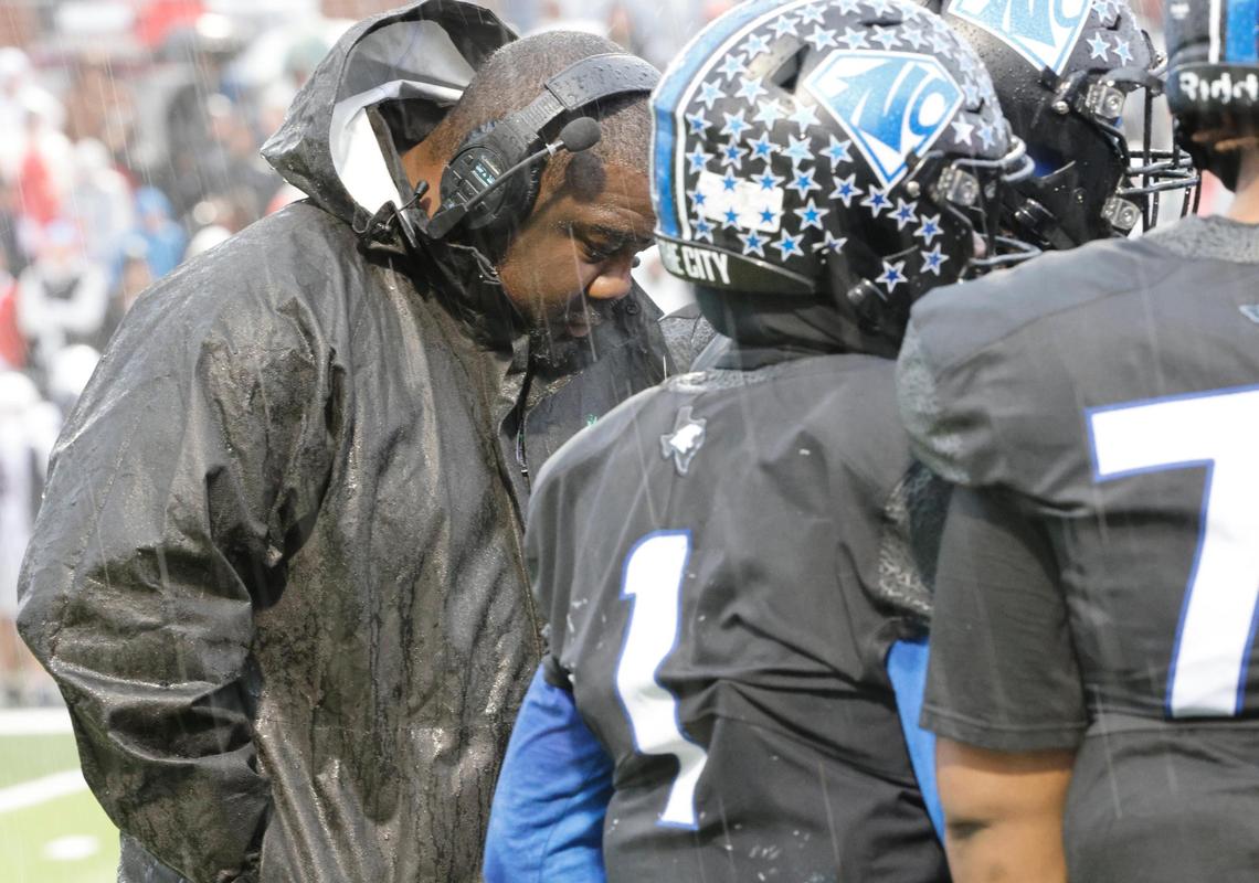 North Crowley head coach Ray Gates listens to the OC during a timeout during the UIL 6A D1 Quarterfinals at Vernon Newsom Stadium in Mansfield, Texas, Saturday, Dec. 07, 2024.