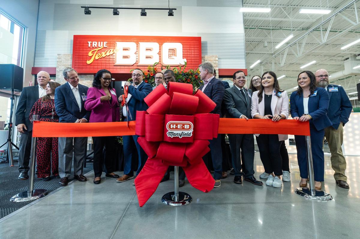 HEB representatives and dignitaries prepare to cut the ribbon to celebrate the new HEB location in Mansfield on Tuesday, June 25, 2024.