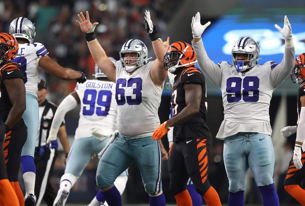 Dallas Cowboys corner Tyler Biadasz, left, and defensive tackle Quinton Bohanna celebrate a field goal which gave them the win against the Cincinnati Bengals on Sunday, September 18, 2022.