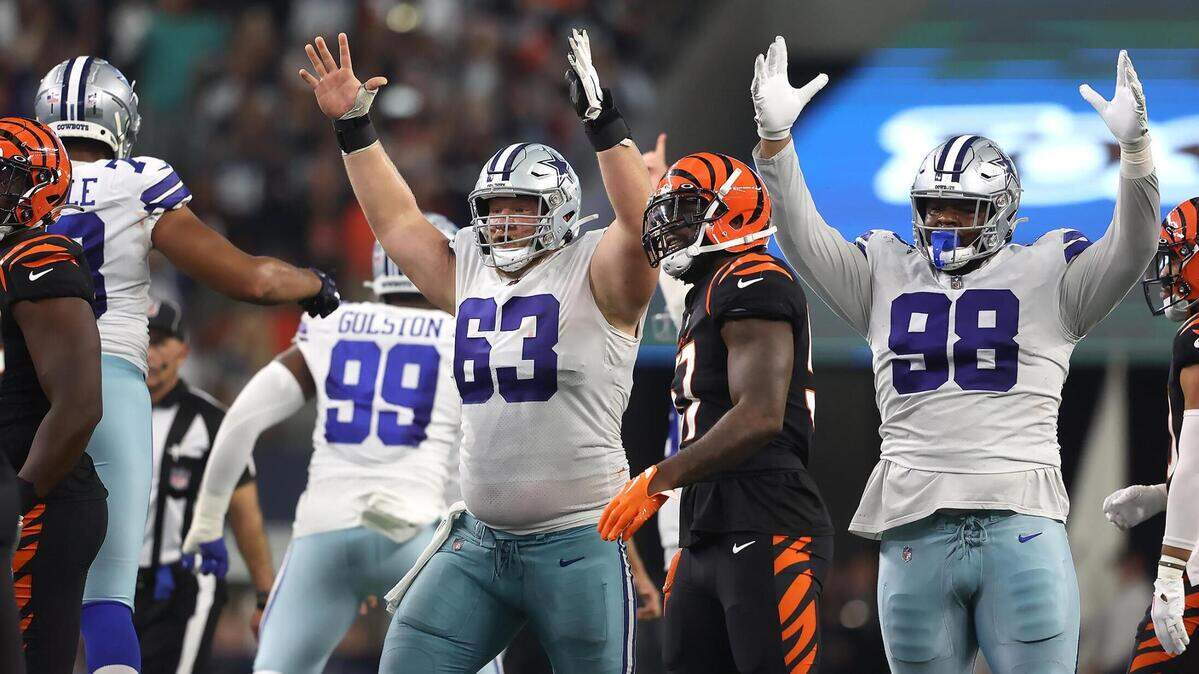 Dallas Cowboys corner Tyler Biadasz, left, and defensive tackle Quinton Bohanna celebrate a field goal which gave them the win against the Cincinnati Bengals on Sunday, September 18, 2022.