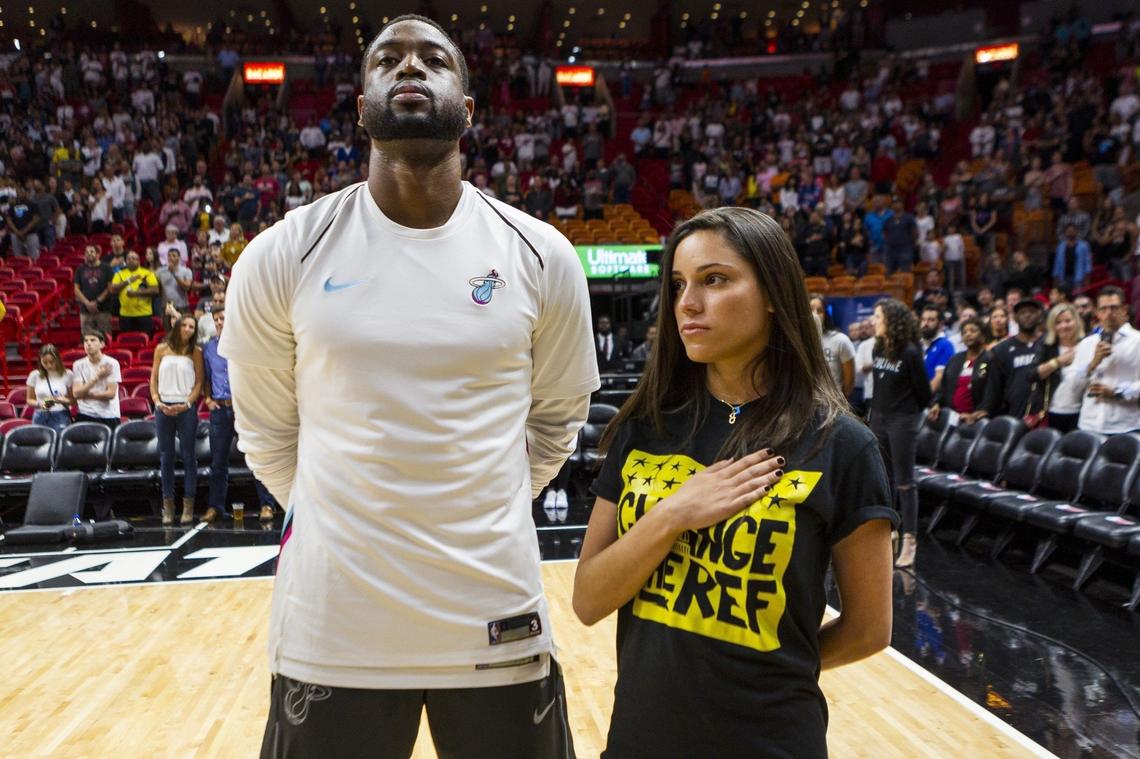 Dwyane Wade of the Miami Heat stands with Andrea Ghersi, the sister of Joaquin Oliver, a 17-year-old student who was slain on Feb. 14 during the mass shooting at a Parkland, Fla., high school.