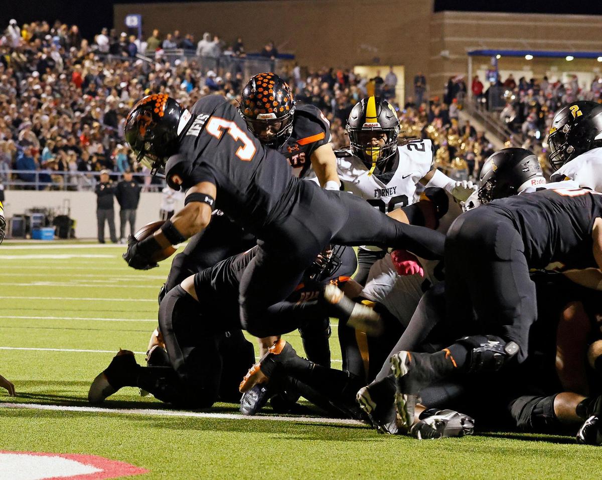 Aledo linebacker Davhon Keys (3) goes up and over for six during the first half of a UIL Conference 5A Division I Semifinal football playoff game at Midlothian ISD Stadium in Midlothian, Texas, Friday, Dec. 08, 2023.