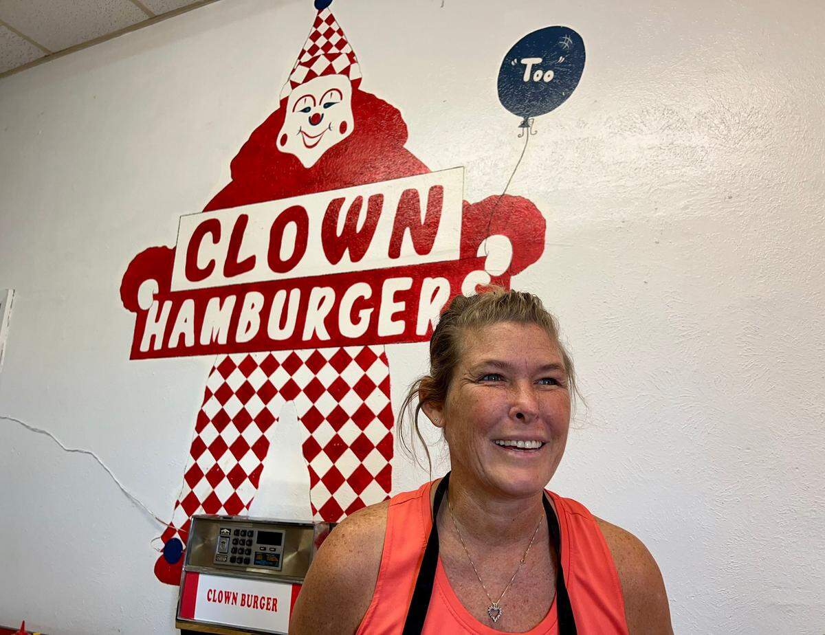 Owner Kari Snodgrass in Clown Burger Nov. 16, 2022, on the verge of selling a 1950s burger diner that has been in her family since 1959.