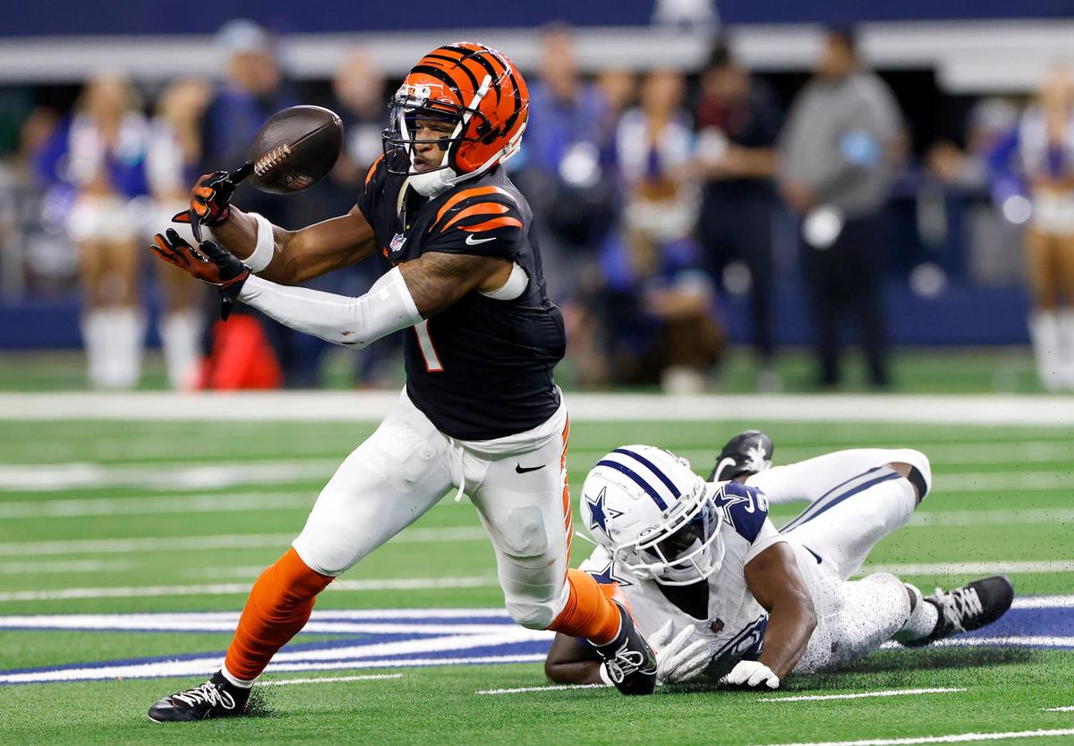Cincinnati Bengals wide receiver Ja’Marr Chase attempts to complete a pass while covered by Dallas Cowboys’ Jourdan Lewis on Monday, Dec. 9, 2024, at AT&T Stadium in Arlington.