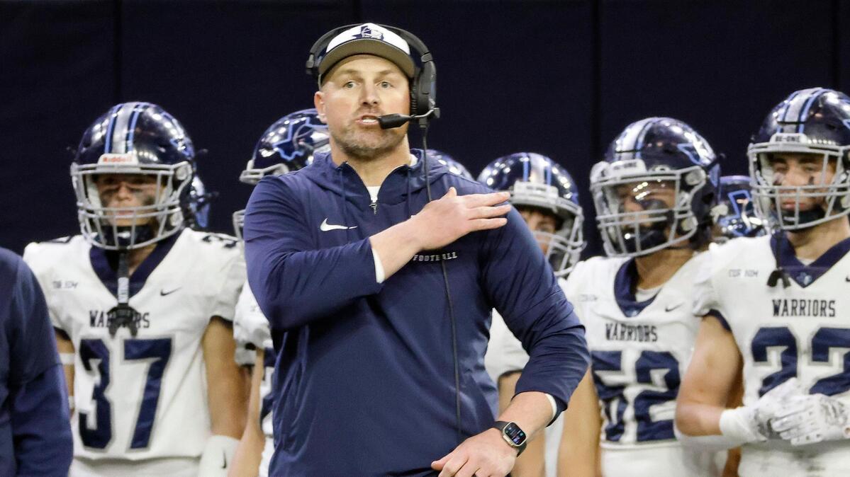Liberty Christian head coach Jason Witten sends in the play in the first half of a TAPPS Region 2 semi-final football playoff game at The Ford Center in Frisco, Texas, Saturday, Oct. 25, 2023.