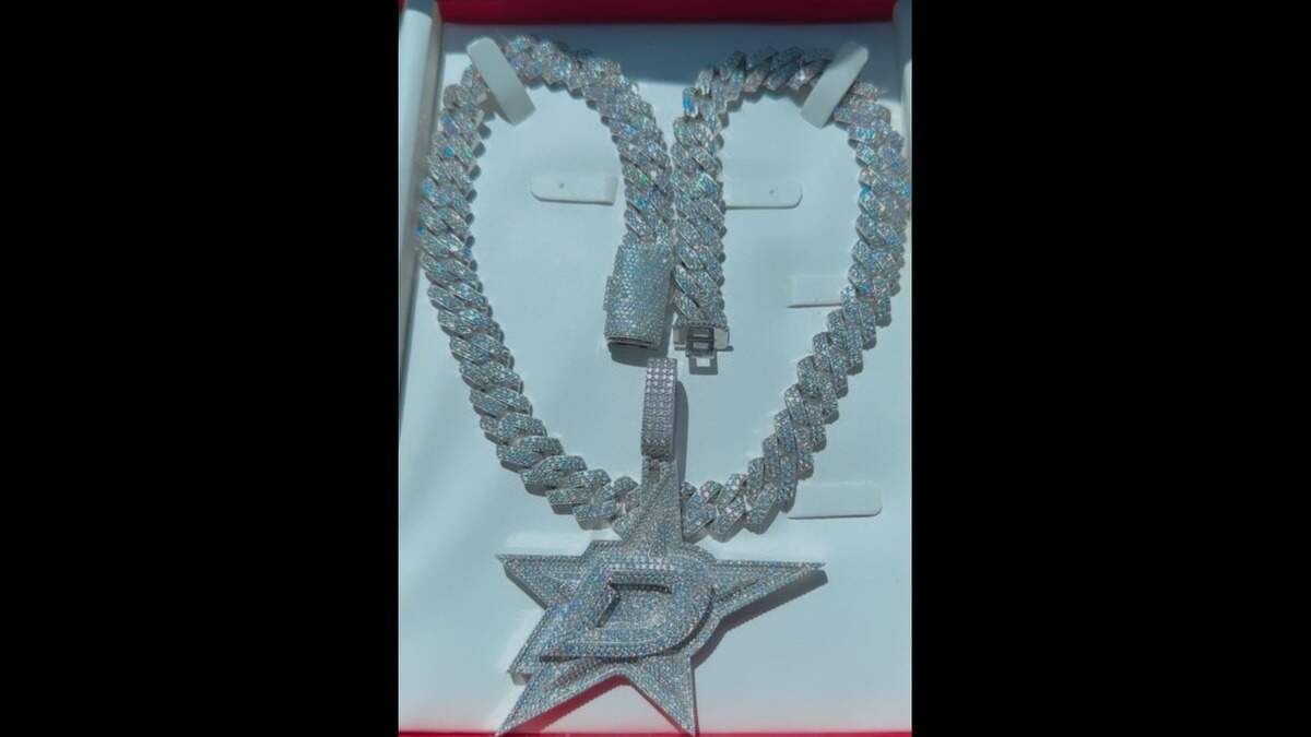 Several items, including this necklace Devin Danford was wearing at a Dallas club the night before he died, were missing from his Fort Worth apartment, police said.