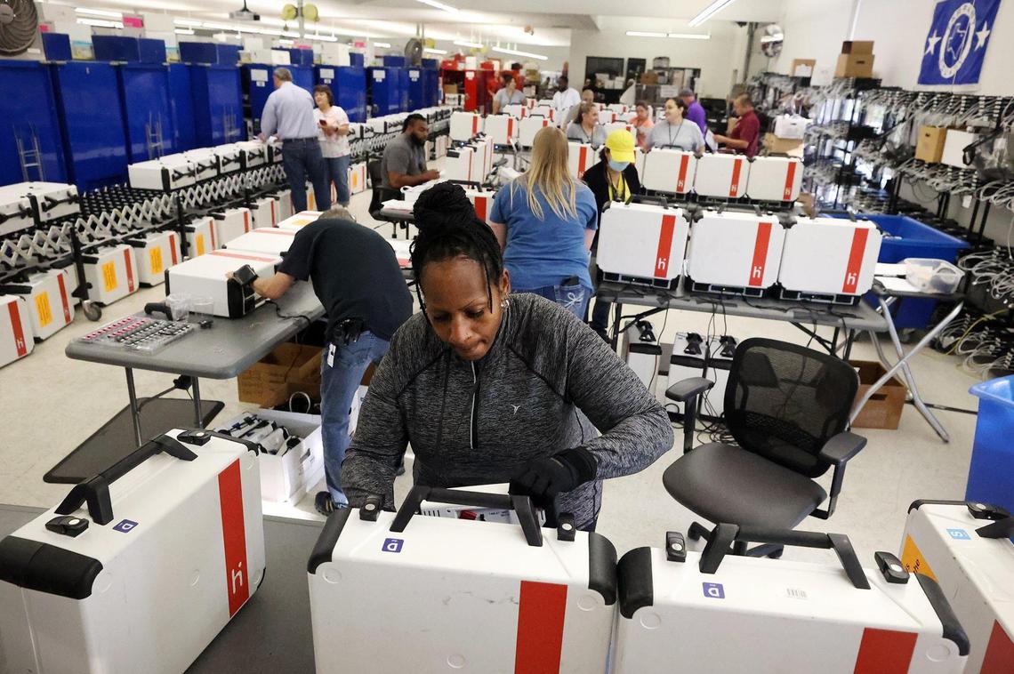 Sharon Smith, a Tarrant County Election Commission employee, tests voting machines for accuracy on Friday at the Tarrant County Elections Administration Office. For the first time ever the public was invited to fill out test ballots in an effort to boost confidence in the system.