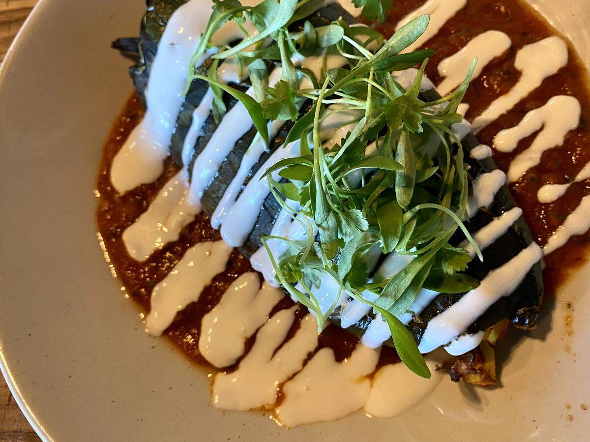 A roasted chile relleno with lime crema and salsa, from the brunch menu at Wishbone & Flynt.