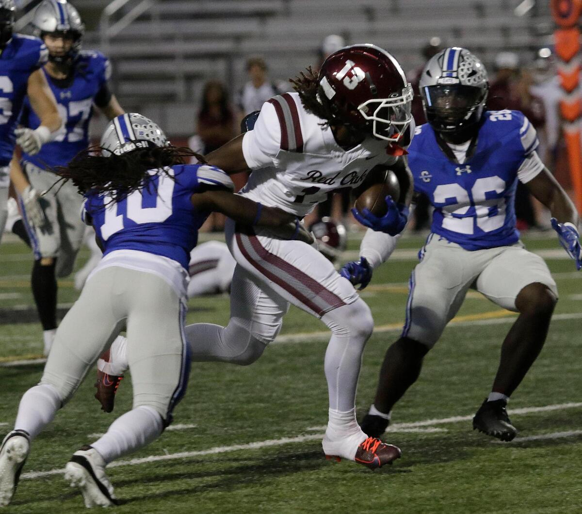 Red Oak’s Jacque Overton breaks a tackle during a UIL football game at Burleson ISD Stadium on Friday October 25, 2024.