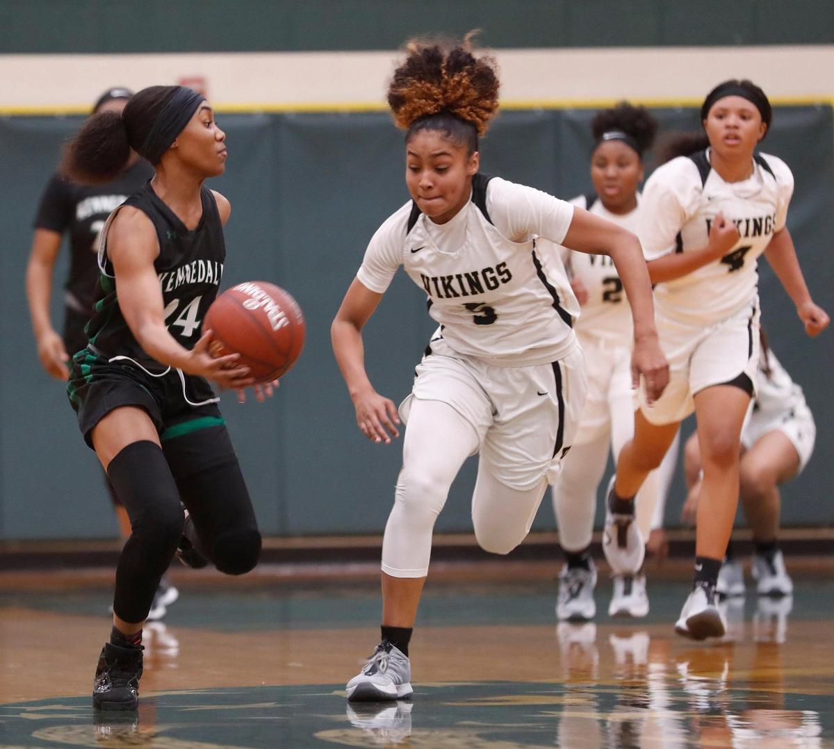 Kennedale guard Jayla Harvey (24) passes the ball across court in front of Pinkston guard Victoria Flores (5) during the first half of a 4A Region 2 quarterfinal basketball game at DeSoto High School in DeSoto, Texas, Wednesday, Feb. 24, 2021. Pinkston led Kennedale 19-11 at the half. (Special to the Star-Telegram Bob Booth)