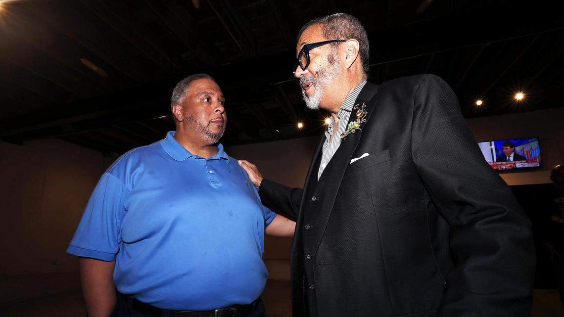 Rodrick Miles, left, speaks with Tarrant County Commissioner Roy Brooks during his election party at Blank Space in Fort Worth on Tuesday, March 5, 2024. Miles is running in the Democratic primary for Tarrant County Commissioners Court Precinct 1 to replace Brooks.