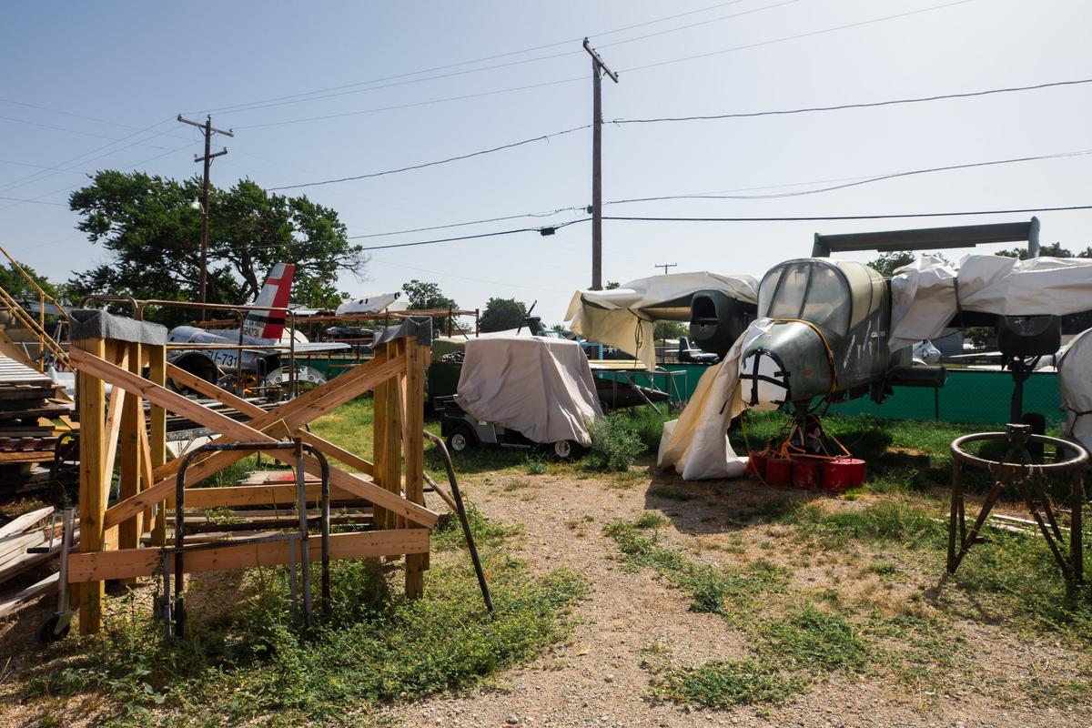 A yard where the museum keeps a variety of parts and equipment for restoring planes on Thursday, August 1, 2024 at the Fort Worth Aviation Museum. The yard also contains a OV-10 Bronco mockup. The mockup is used as a display to understand and educate how other OV-10’s are constructed and function.