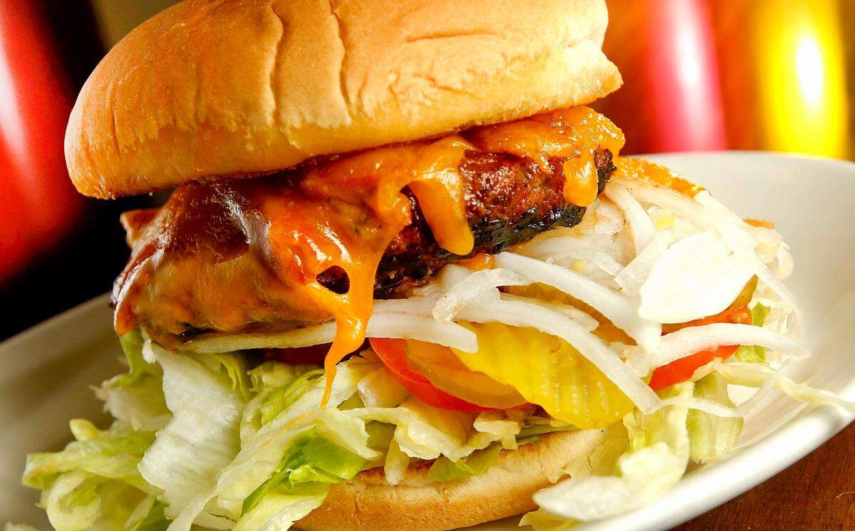 The Original Chop House Burgers’ signature burger is a brisket blend bacon cheddarburger with steak sauce.