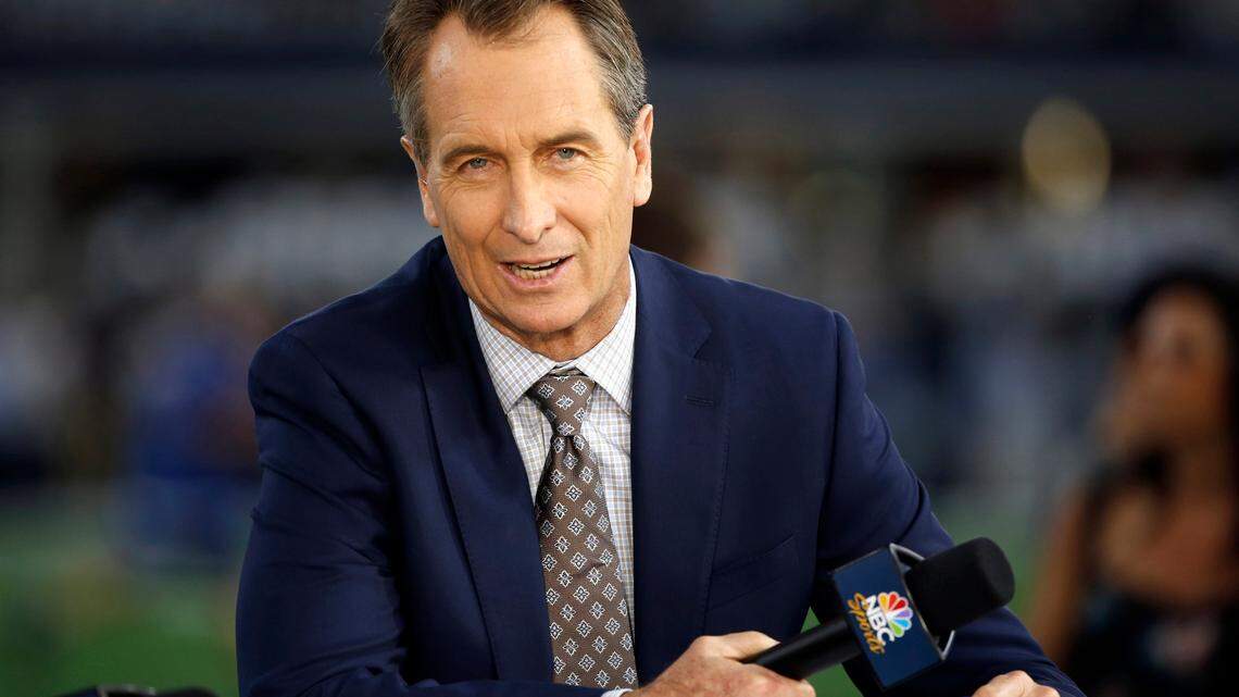 FILE - In this Oct. 30, 2016, file photo, NBC Sunday Night Football cast member Cris Collinsworth sits on the set during pregame of an NFL football game between the Philadelphia Eagles and the Dallas Cowboys in Arlington, Texas. (AP Photo/Ron Jenkins, File)