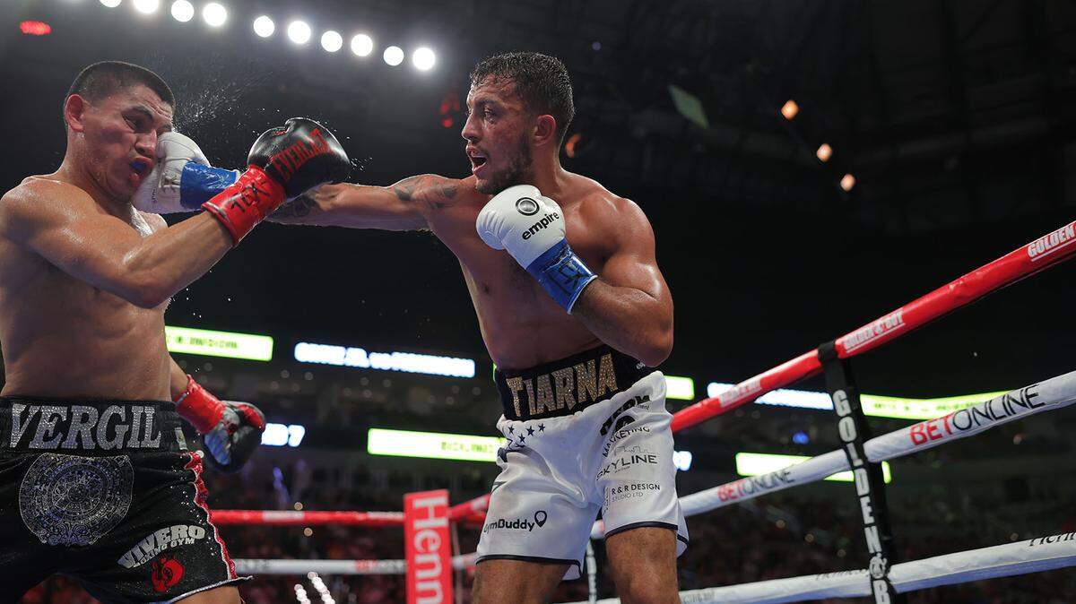 Left-handed boxer Michael McKinson, of Great Britain, lands a right against Grand Prairie native Vergil Ortiz Jr., left, early in a welterweight fight Saturday night at Dickies Arena in Fort Worth. Ortiz Jr. won with a TKO in the ninth round to improve to 19-0, with 19 knockouts.