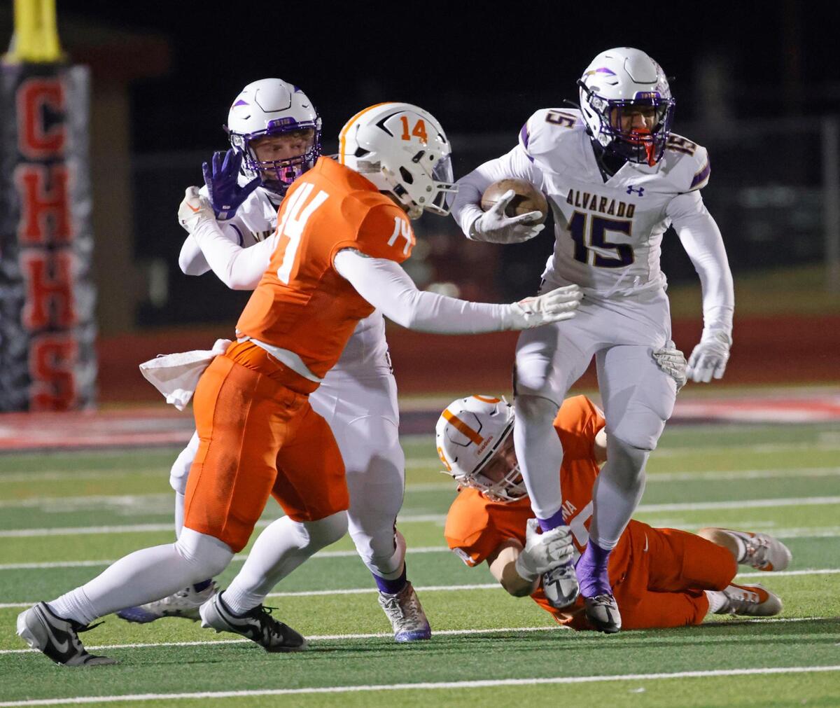 Alvarado wide receiver Lance Sansom (15) attempts to get out of the backfield during the UIL 4A D1 Quarterfinals at Mustang-Panther Stadium in Grapevine, Texas, Friday, Dec. 06, 2024.