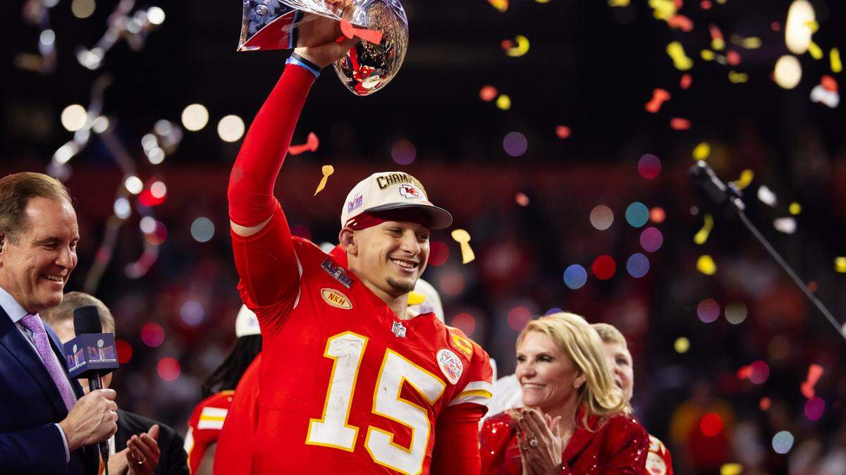 Feb 11, 2024; Paradise, Nevada, USA; Kansas City Chiefs quarterback Patrick Mahomes (15) celebrates with the Vince Lombardi Trophy after defeating the San Francisco 49ers in overtime of Super Bowl LVIII at Allegiant Stadium. Mandatory Credit: Mark J. Rebilas-USA TODAY Sports