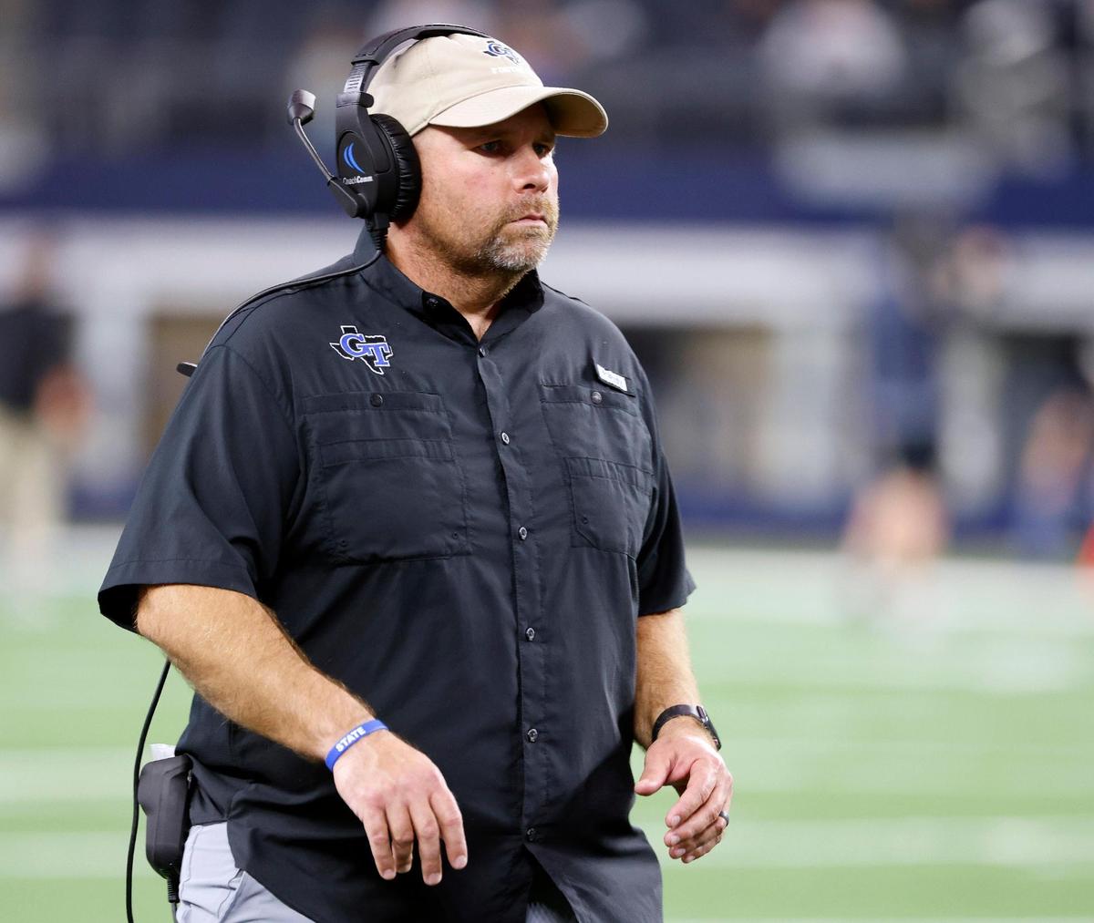 Gunter head coach Jake Fieszel looks on during the first half of the UIL Conference 3A Division 2 state championship football game at AT&T Stadium in Arlington, Texas, Thursday, Dec. 14, 2023.