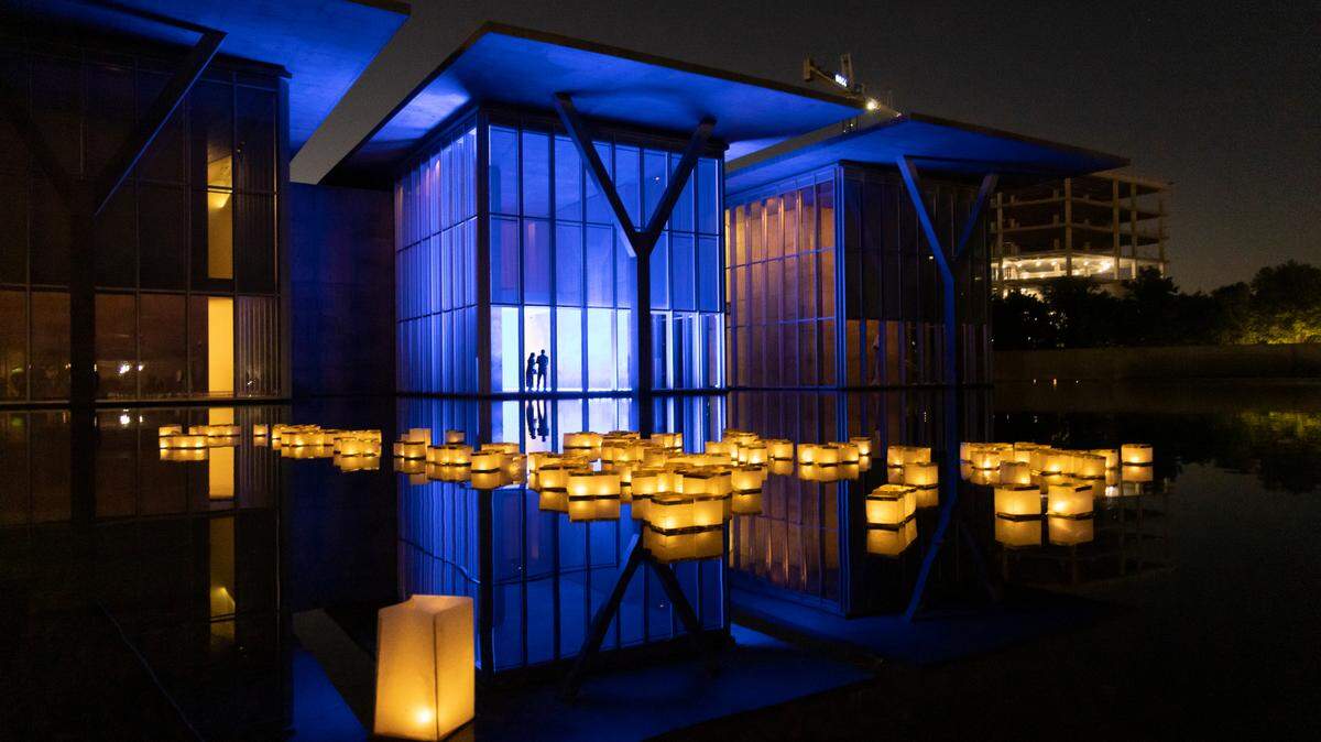 Lanterns float on the large reflecting pond outside of the Modern Art Museum of Fort Worth.