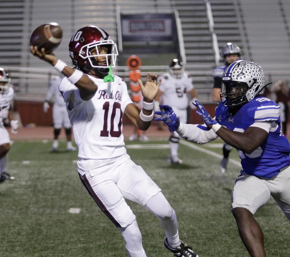 Red Oak’s Billy Middleton throws a pass during a UIL football game at Burleson ISD Stadium on Friday October 25, 2024.