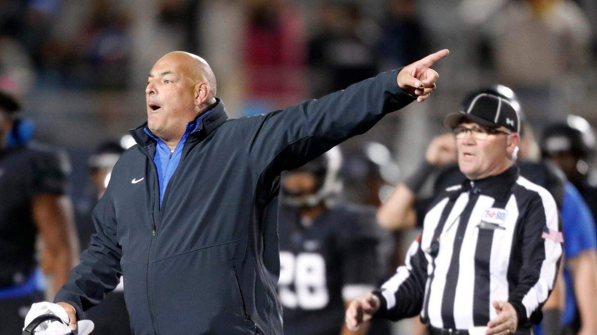 Former Hebron football coach Brian Brazil , shown during 2017 game, died Wednesday at 58.