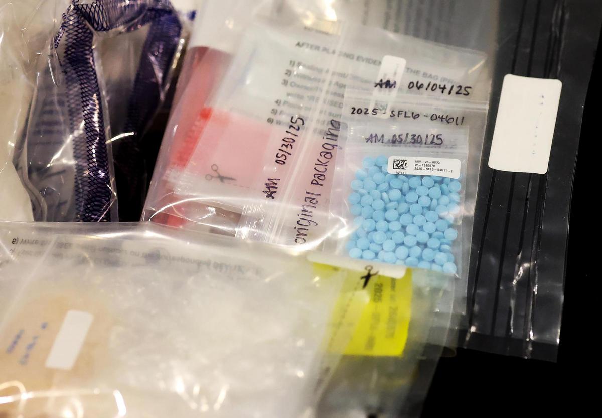 A selection of illegal drugs and pills are on display during a press conference held by law enforcement agencies on Wednesday, June 18, concerning an operation conducted in Fort Worth that focused on violent crimes.