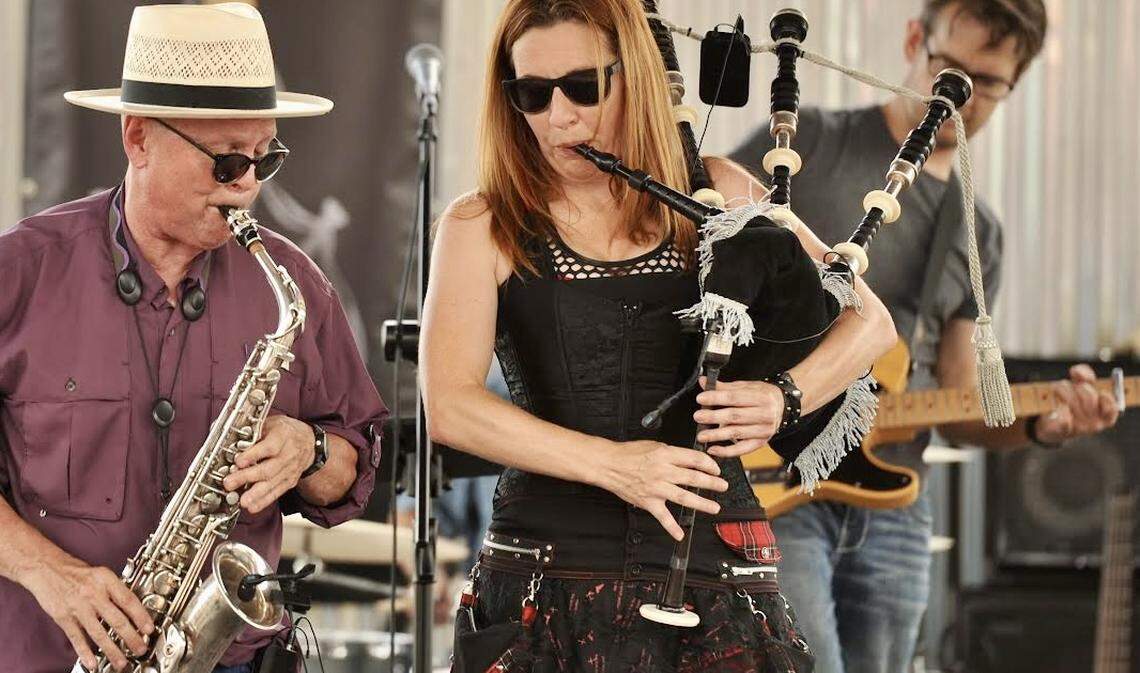 Kate Pressel plays the bagpipe with Terry Parrish, left, on saxophone and Jason Cartmell on guitar in Rockstrocity.