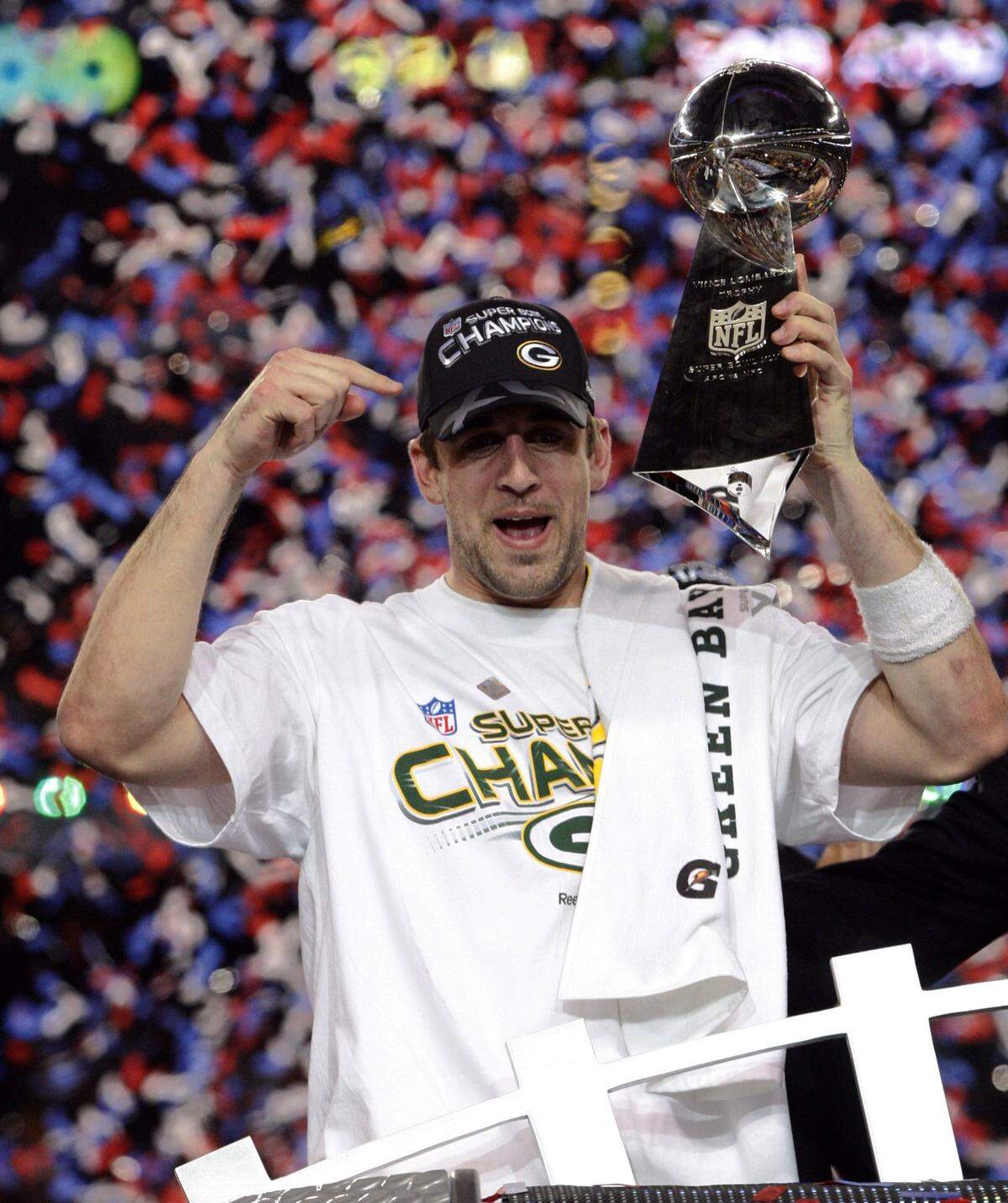 Green Bay Packers quarterback Aaron Rodgers reacts with the trophy at Super Bowl XLV in Arlington, Texas, Sunday, Feb. 2, 2010. Green Bay won, 31-25.  (Star-Telegram/ Ron T. Ennis) ORG XMIT: RTE134
