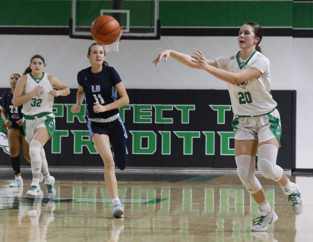 Southlake guard Whitney Jense (20) tosses the ball ahead against L.C. Bell during the second half of a UIL girls basketball game between L.D. Bell and Southlake Carroll at Southlake Senior High School in Southlake, Texas, Tuesday Feb. 03, 2026