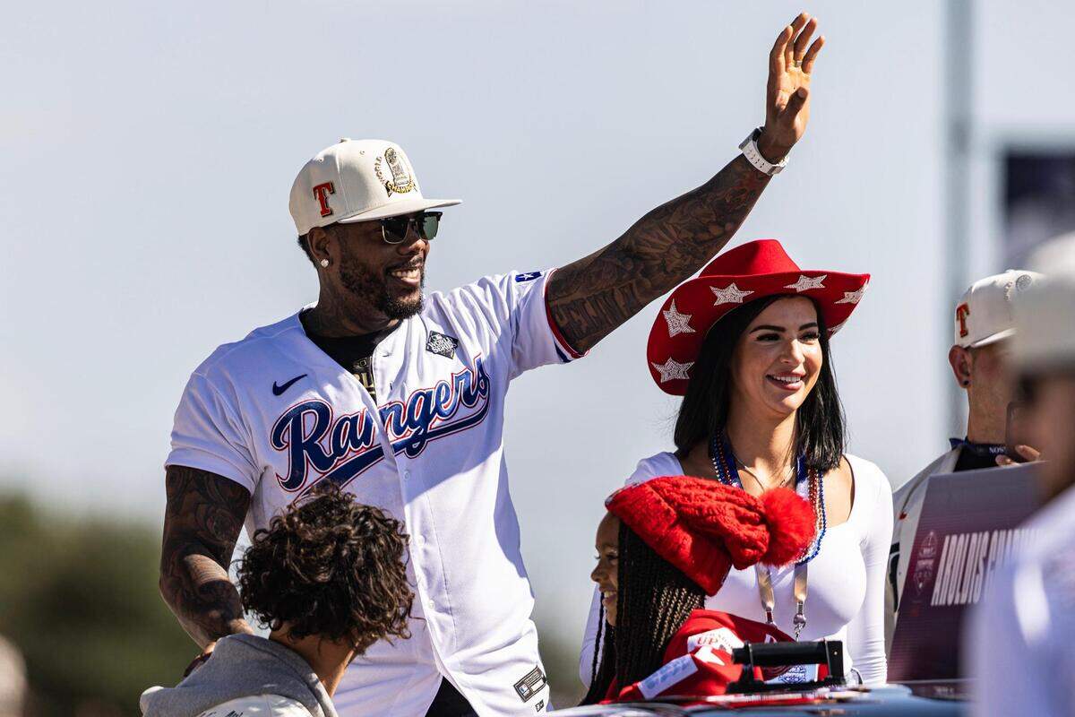 Rangers pitcher Aroldis Chapman waves to the crowd for the World Series Parade in front of Globe Life Field in Arlington on Friday, Nov. 3, 2023.